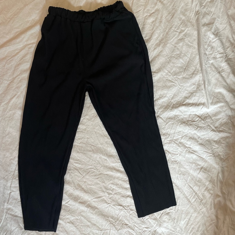 Pleated black plisse easy pant in the style of Issey Miyake